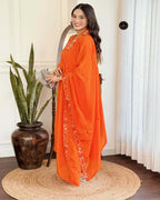 Trendy orange three piece kurta set with round neck style and festive ready look