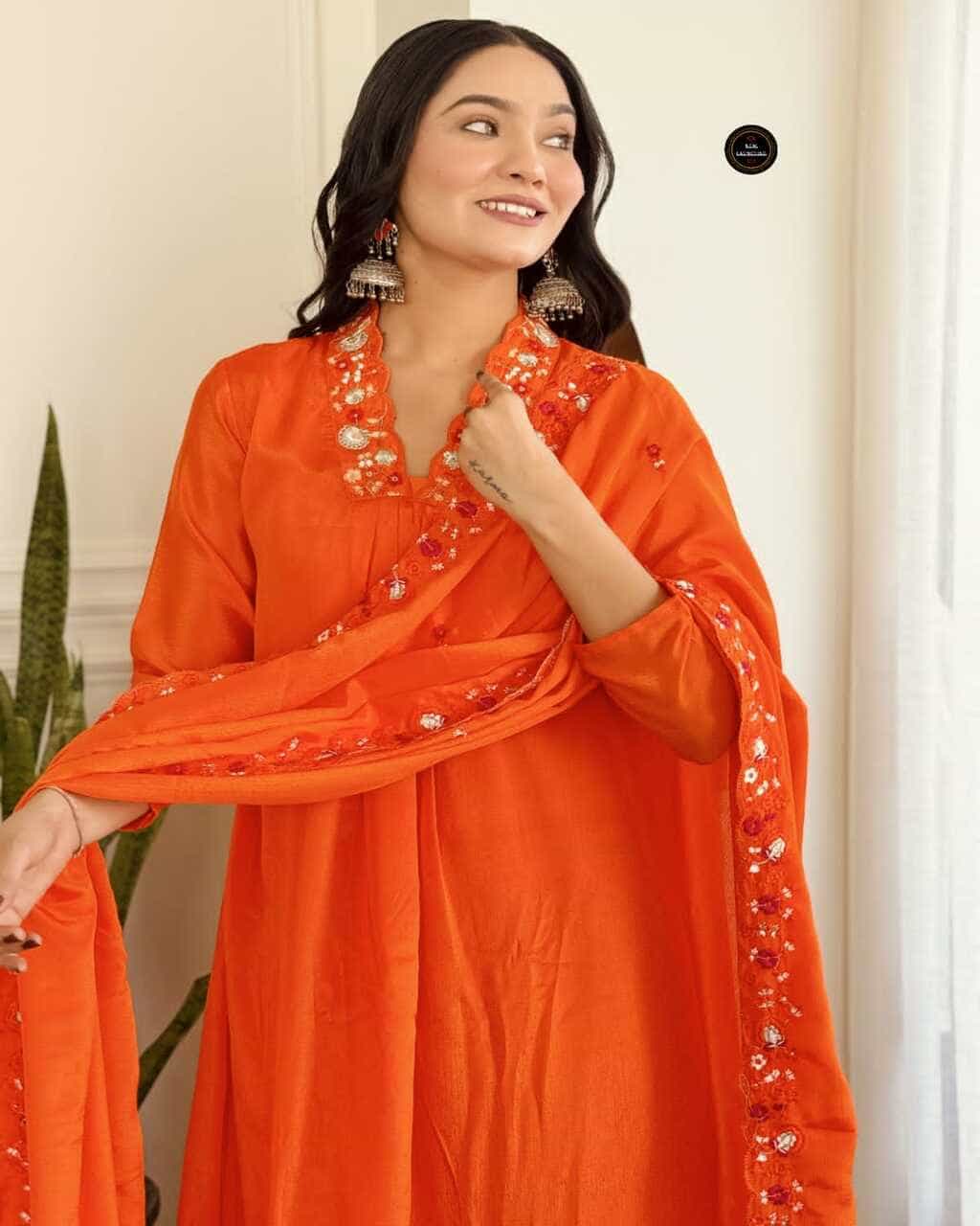 Orange ethnic kurta set for women featuring round neck and festive embroidery look