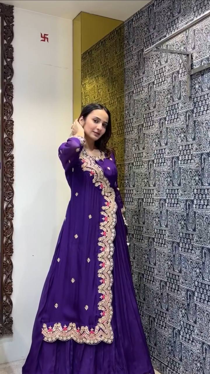 Luxurious purple gown with embroidery and foil details, ideal for festive occasions.
