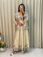 Elegant cream gown with embroidered koti, perfect for weddings and festive occasions