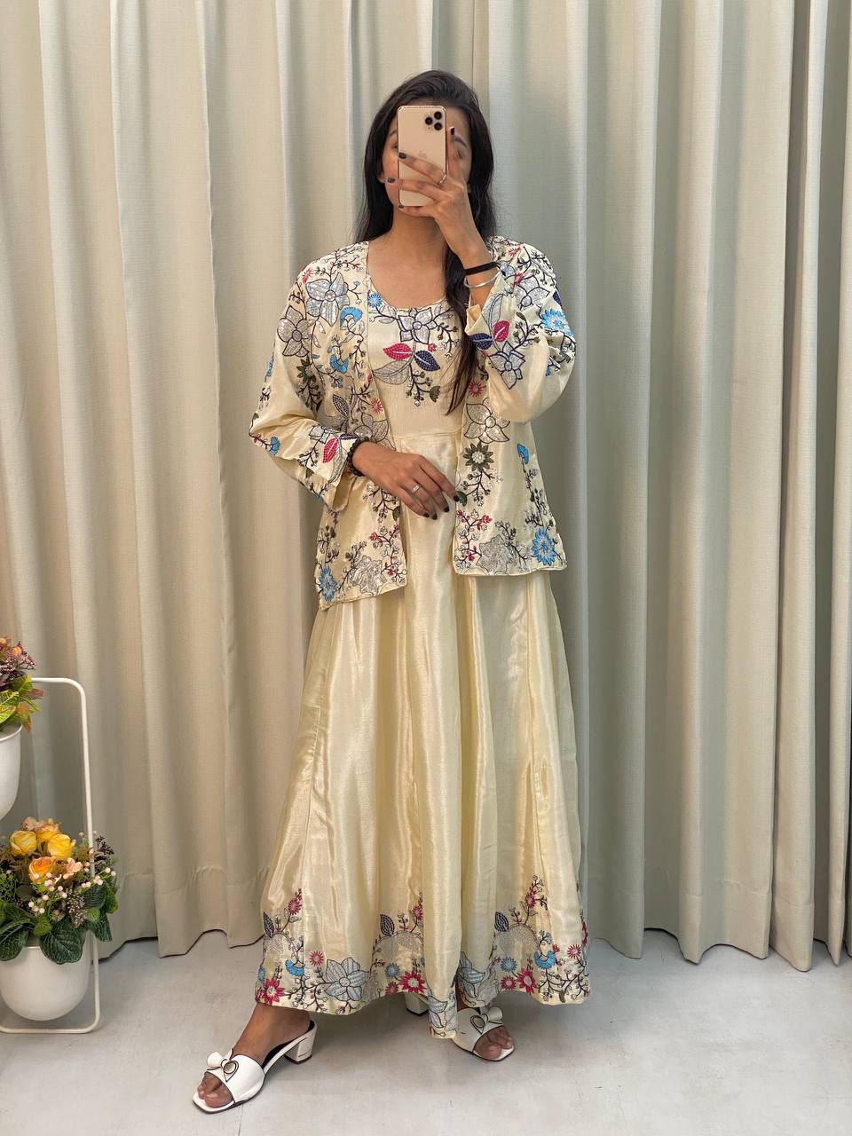 Elegant cream gown with embroidered koti, perfect for weddings and festive occasions