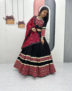 Traditional black lehenga choli with red dupatta and embroidered details for Navratri