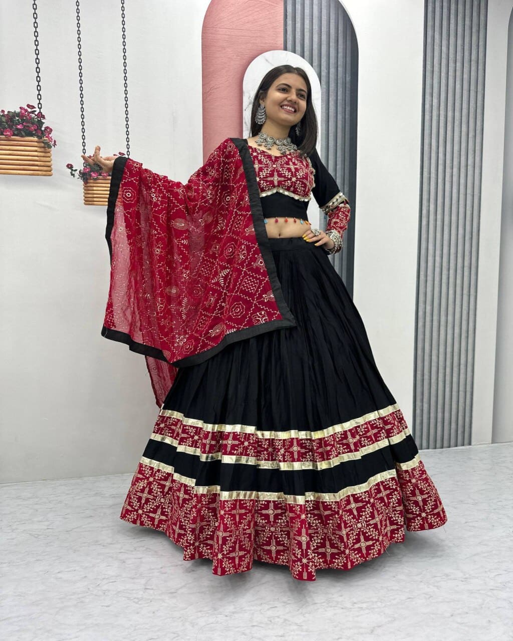 Festive black lehenga choli for women with red dupatta and heavy embroidered design

Designer cotton black red lehenga choli set for Navratri and wedding occasions