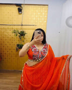 Orange mirror work lehenga choli in georgette fabric for Navratri and Garba nights