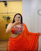 Orange Navratri lehenga choli with 9-meter flair and lace dupatta in georgette