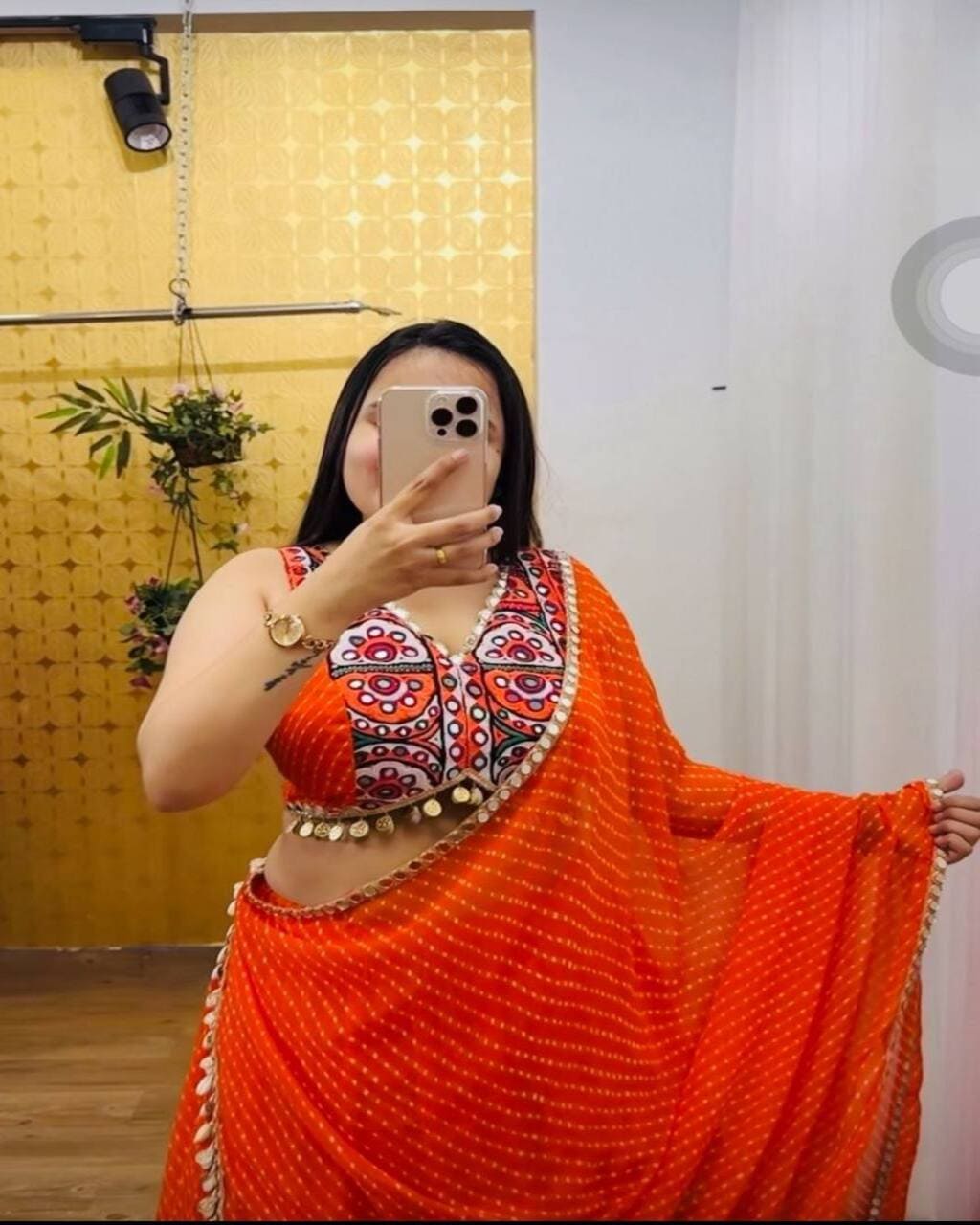 Orange Navratri lehenga choli with 9-meter flair and lace dupatta in georgette