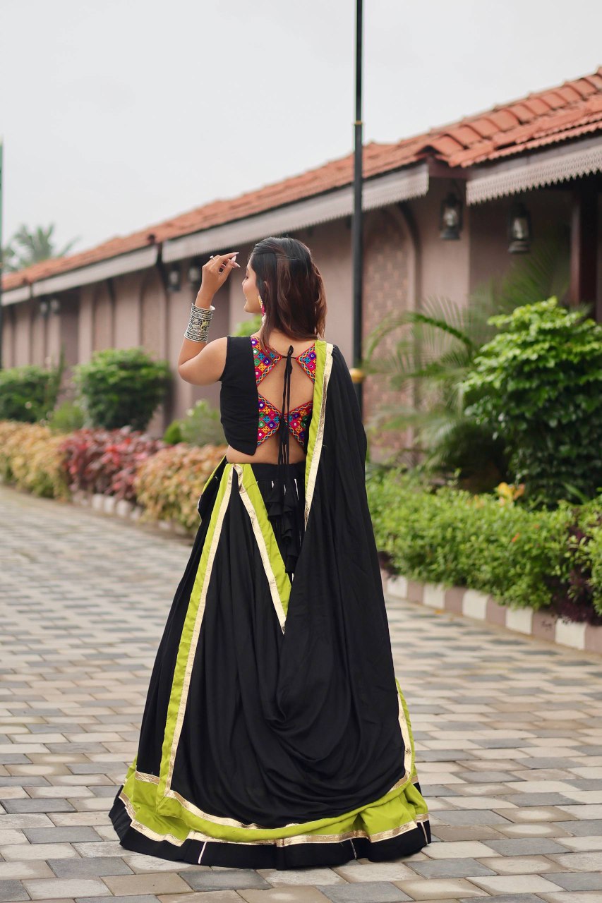 Traditional black cotton lehenga choli with Gamthi mirror work and ribbon lace detailing