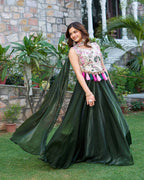 Traditional mehndi green lehenga choli outfit with rich embroidery and silk fabric