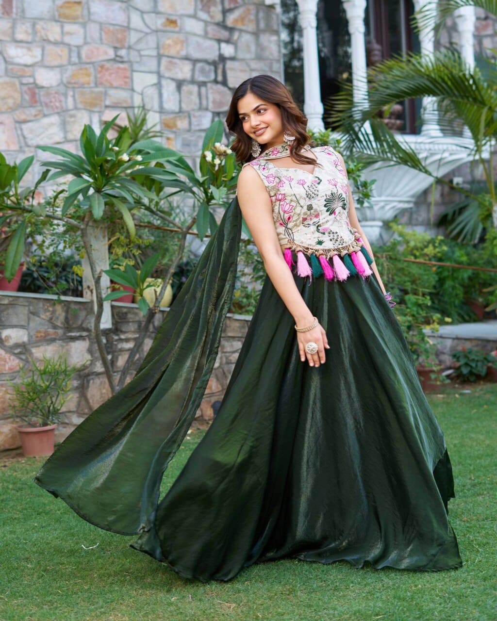 Traditional mehndi green lehenga choli outfit with rich embroidery and silk fabric