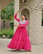 Stylish pink gown navratri wear crafted in faux georgette with traditional mirror work