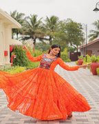 Elegant Orange Gown with mirror and thread embroidery for festive occasions
