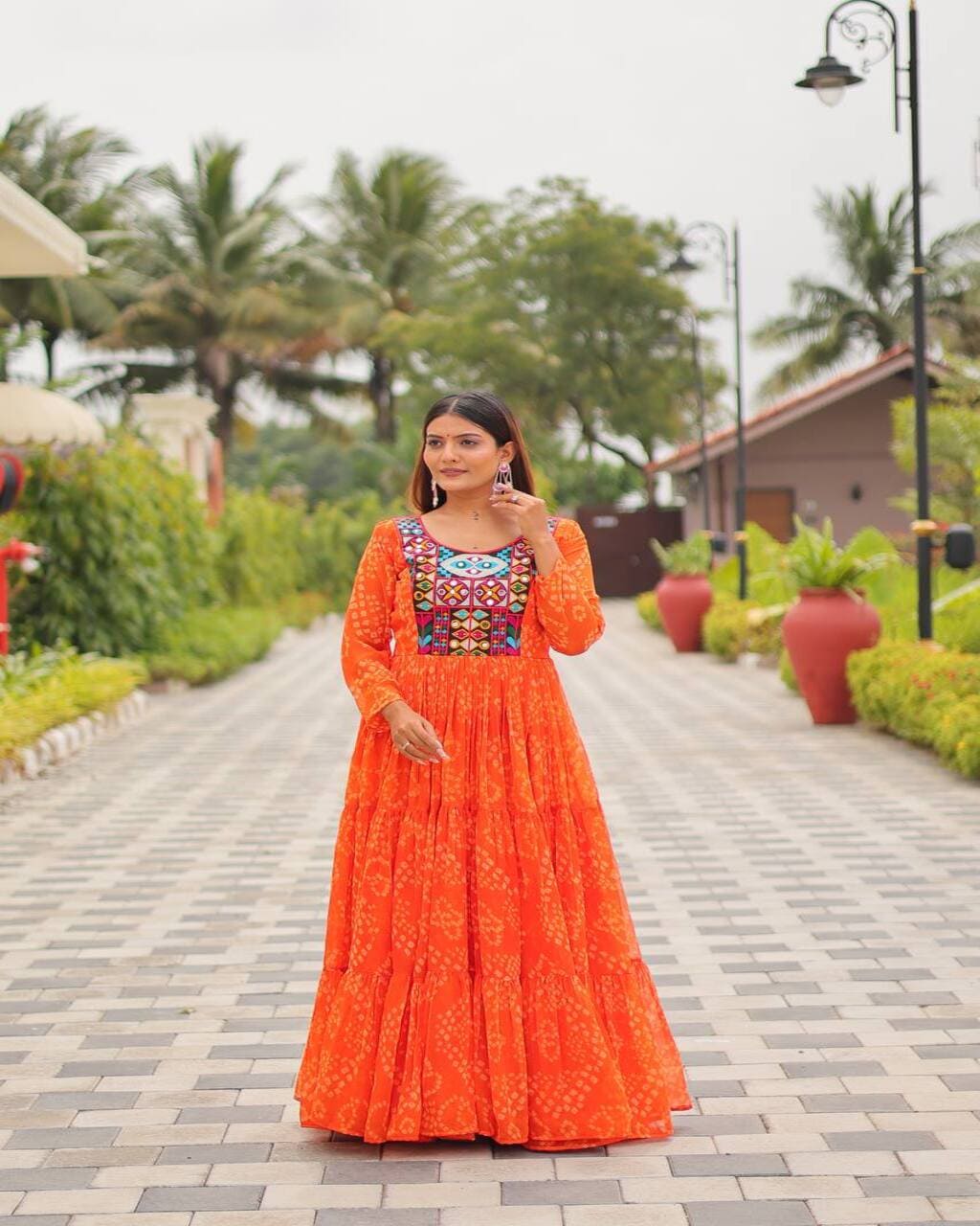 Designer Orange Gown with embroidery and micro cotton inner for festive wear