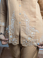 Premium dark cream embroidery work closeup on Royal Siffon fabric with elegant designer detailing