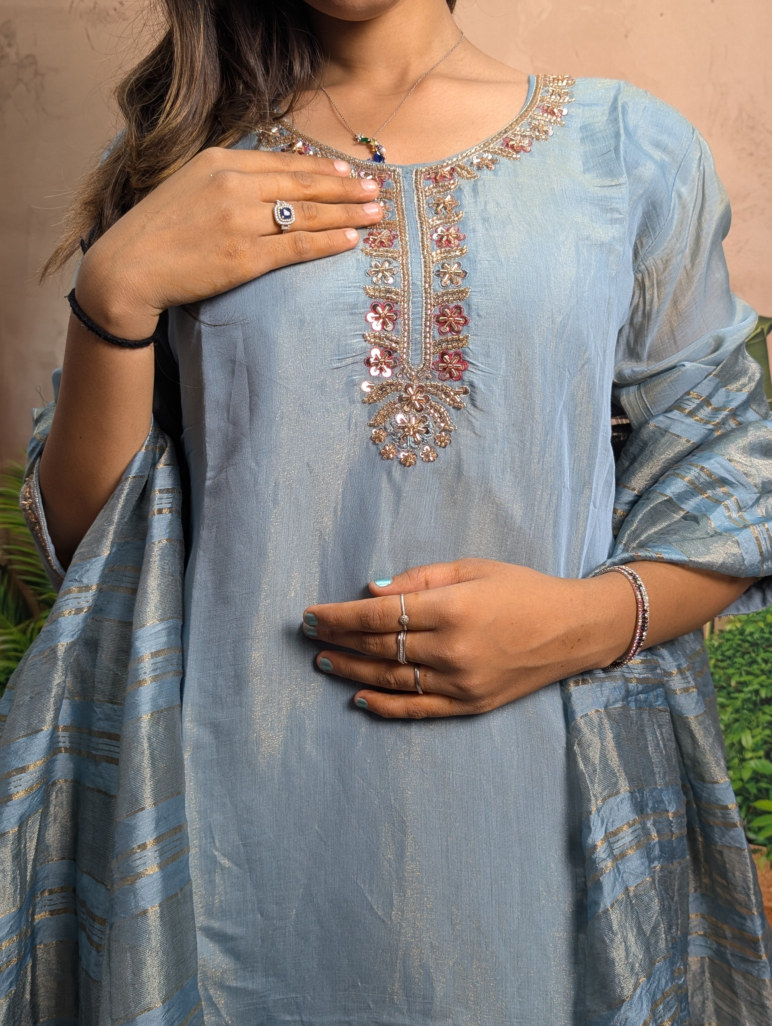 Premium dark firozi beads work closeup on Mal Simmer fabric with elegant designer detailing
