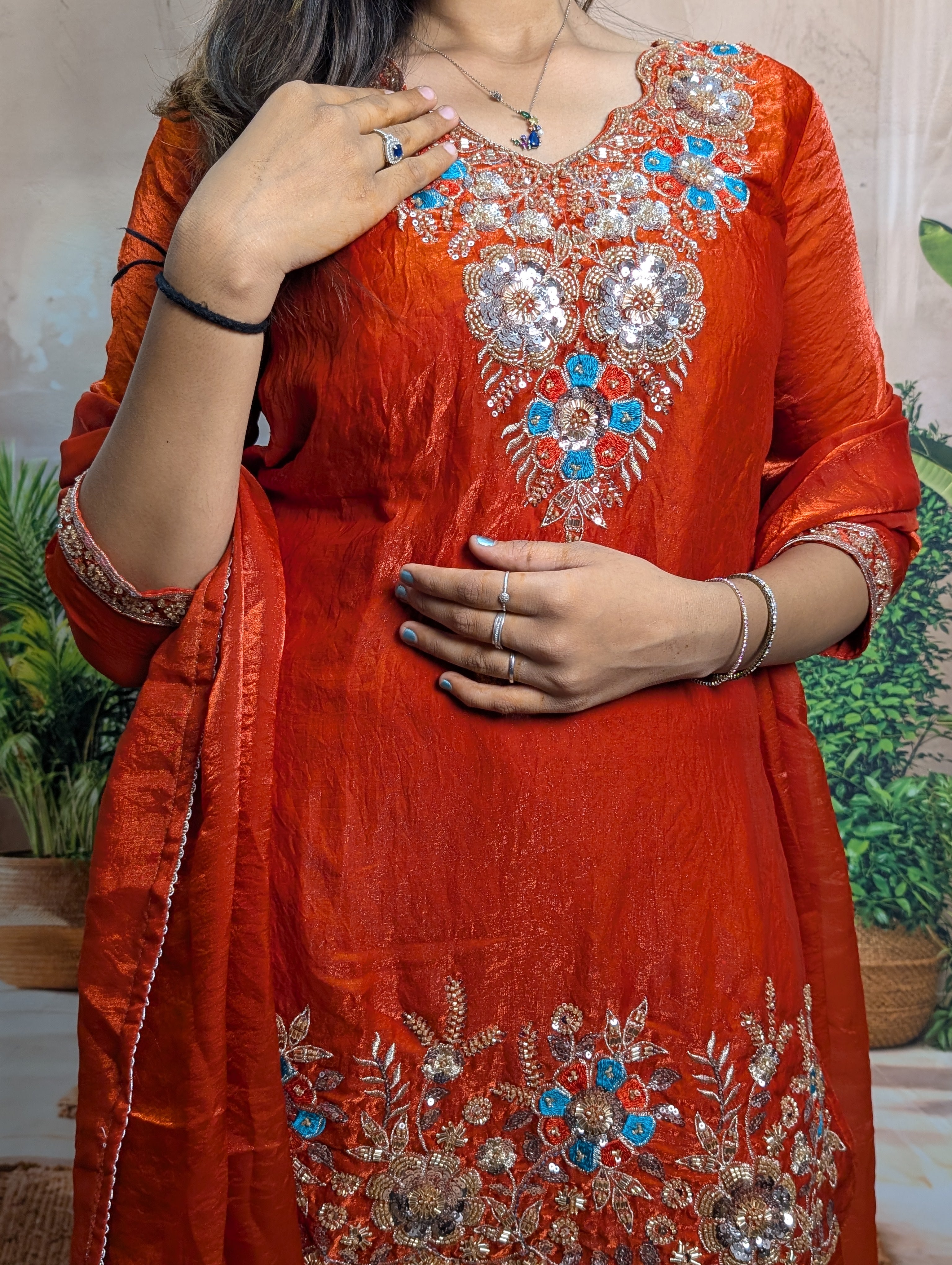 Designer rust orange heavy beads work on premium Fendy fabric with elegant wedding wear detailing
