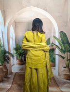 Premium luxury yellow ethnic palazzo suit back view for women with graceful traditional ethnic fashion
