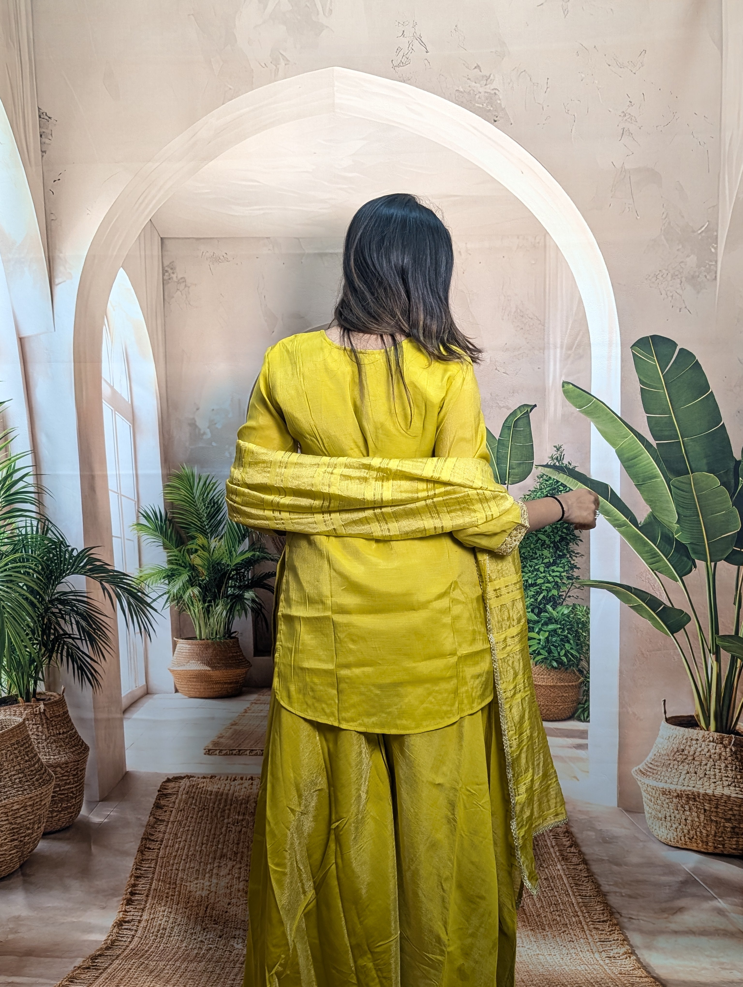 Premium luxury yellow ethnic palazzo suit back view for women with graceful traditional ethnic fashion
