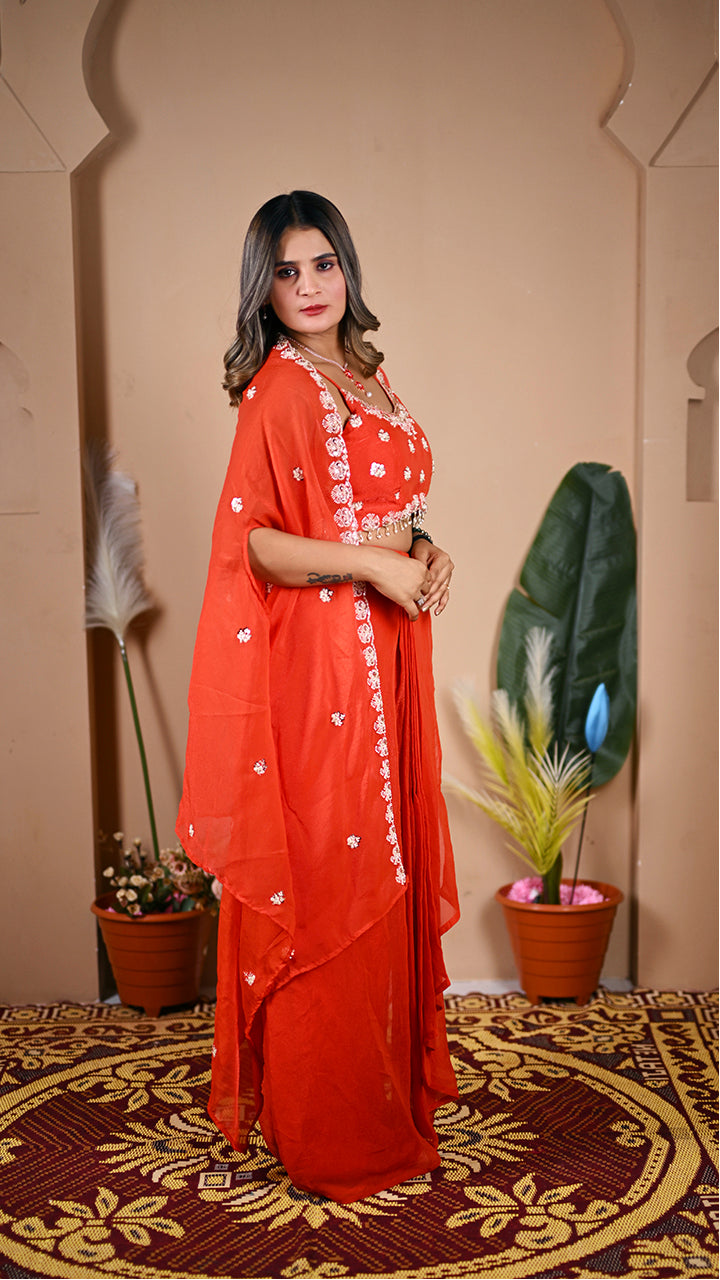 Stylish orange indo western outfit side view with pleated skirt
