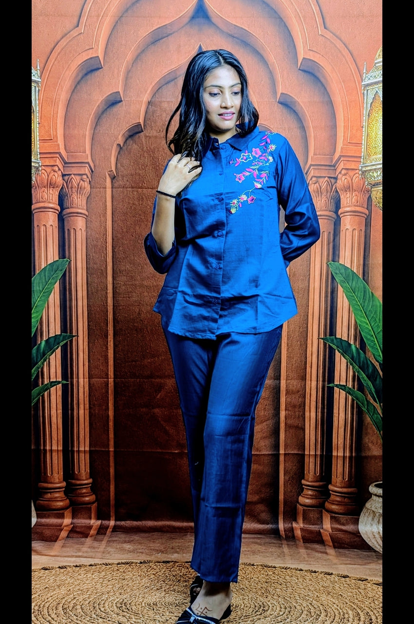 Close up view of premium blue co ord set showing vartican fabric and embroidery detailing