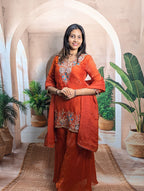 Elegant model wearing designer rust orange heavy beaded wedding palazzo set in premium Fendy fabric for festive wear